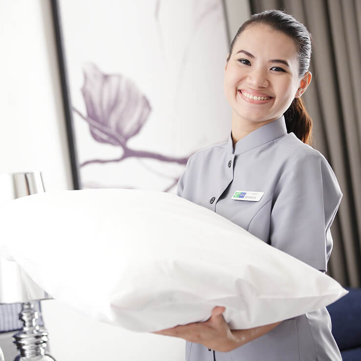 Woman holding pillow